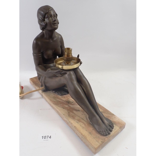 1074 - An Art Deco bronze finish plaster table lamp on 'marble' base with seated lady