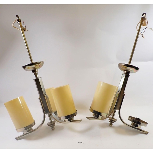 1076 - A pair of Art Deco style chrome stepped three branch light fittings with five glass shades