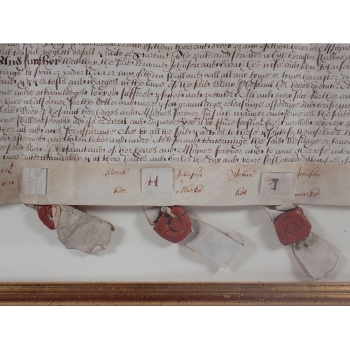 1112 - An 18th century indenture with three wax seals, framed and glazed, 59 x 78cm