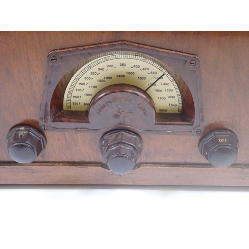 1175 - A Consoldiated Radio in walnut case with sunray design, 36.5 x 44.5cm x 24cm deep