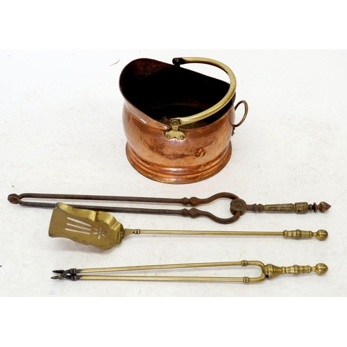 1180 - A copper coal scuttle and three brass fire irons