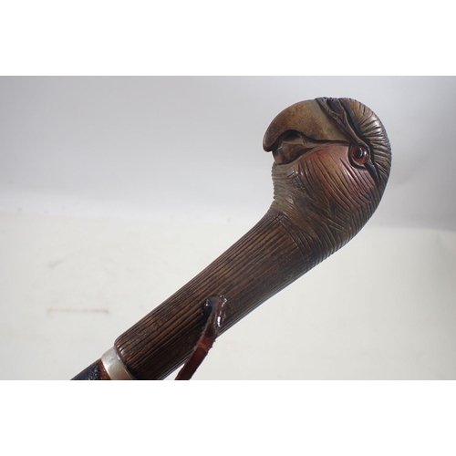 1186 - An early 20th century carved and painted parrots head cane handle on associated bamboo effect ash sh... 