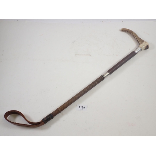 1189 - A horn handled and silver collared riding crop