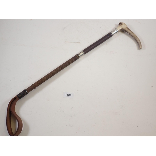 1189 - A horn handled and silver collared riding crop