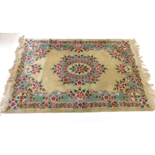 1196 - A Chinese rug decorated roses, 184 x 121 cm