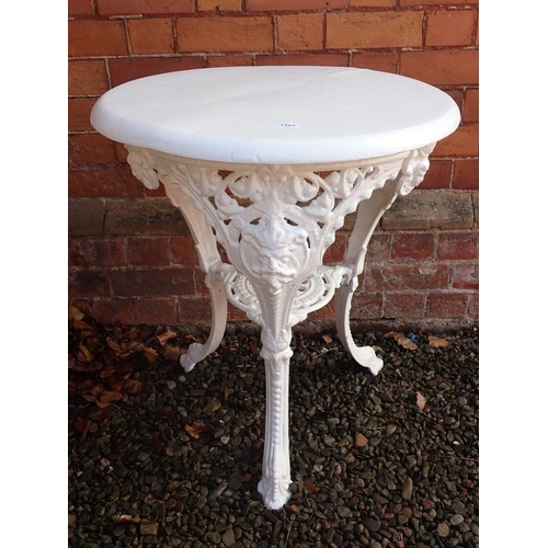 1204 - A Victorian cast iron circular bar or garden table with mask decoration and painted wooden top (loos... 