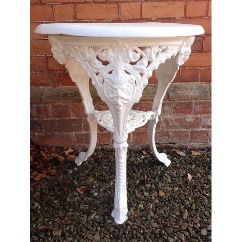 1204 - A Victorian cast iron circular bar or garden table with mask decoration and painted wooden top (loos... 