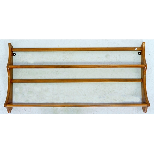 1221 - An Ercol light elm plate rack