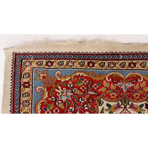 1222 - A Persian style rug with floral design on a cream ground 209 x 151cm