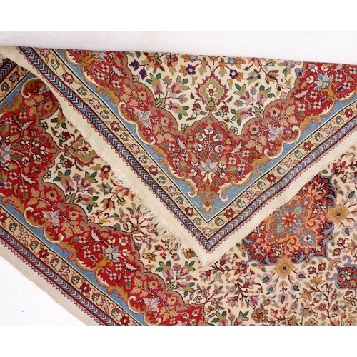 1222 - A Persian style rug with floral design on a cream ground 209 x 151cm