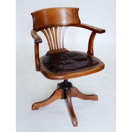 1228 - An early 20th century mahogany slat back swivel desk chair