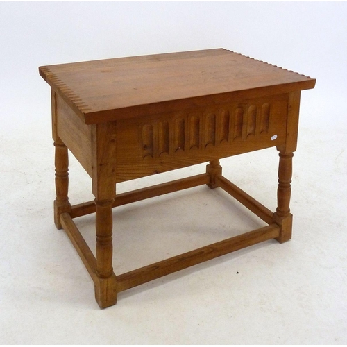 1237 - A light oak carved rise top occasional table, 58cm wide