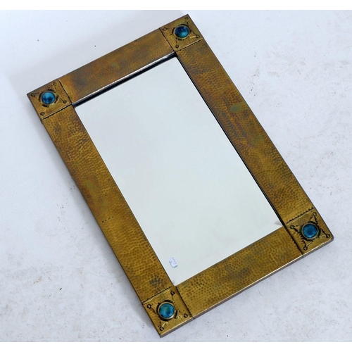 1238 - A Liberty hammered brass framed mirror with turquoise Ruskin roundels and stud detail to corners, ea... 