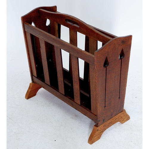 1254 - A Liberty oak magazine rack with pierced tulip cut outs to ends, replacement base 49cm