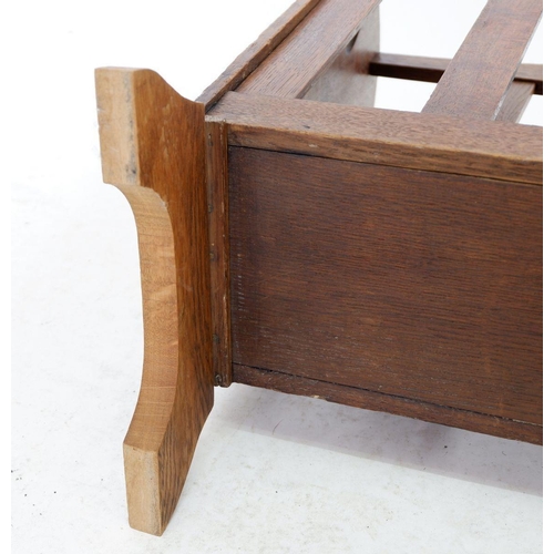 1254 - A Liberty oak magazine rack with pierced tulip cut outs to ends, replacement base 49cm