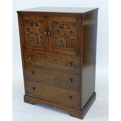 1267 - An oak Jacobean style cabinet with carved cupboard over three drawers 77cm wide