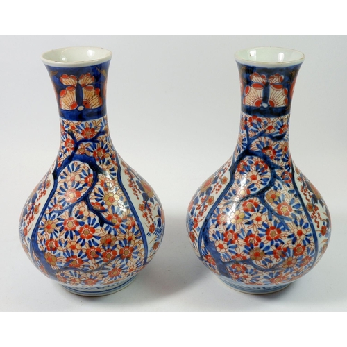 137 - A pair of late 19th century Japanese Imari bulbous vases, 24cm tall