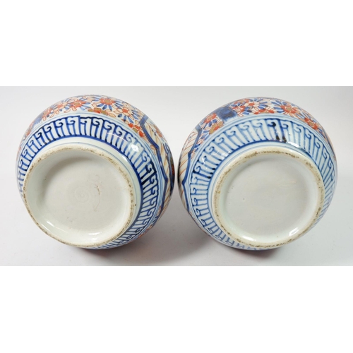 137 - A pair of late 19th century Japanese Imari bulbous vases, 24cm tall