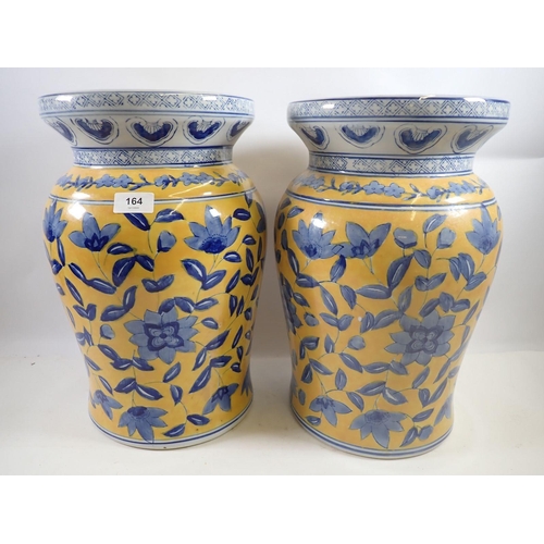 164 - A pair of Chinese blue and yellow floral jardinière stands or stools, 40cm