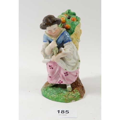 185 - A 19th century porcelain figure of a woman harvesting oranges, 12cm tall