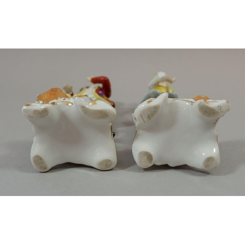 186 - A pair of porcelain figures with gold anchor marks to back, 16cm tall