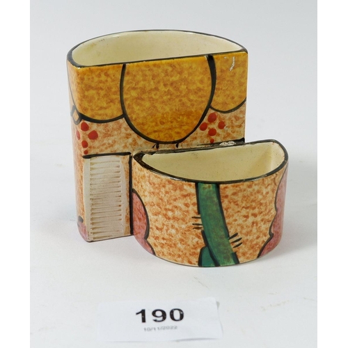 190 - A Clarice Cliff cigarette and match holder marked Cafe au Lait, Bizarre, Newport Pottery