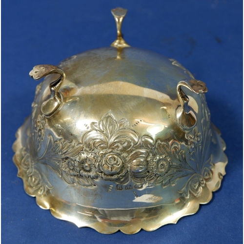 285 - A silver circular sugar bowl with embossed floral and swag decoration, Chester 1898, 93 g by George ... 