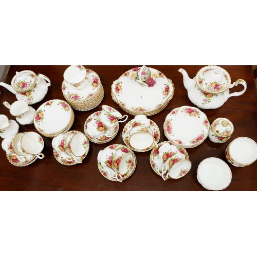 3 - A Royal Albert Country Roses tea service comprising twelve cups and thirteen saucers, three sugar bo... 