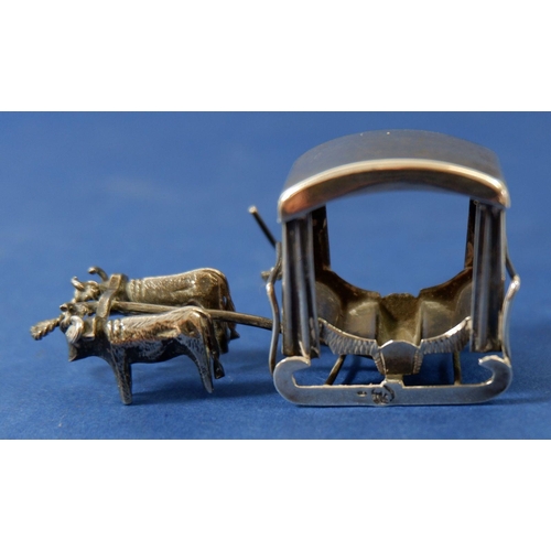 300 - A white metal miniature sleigh pulled by cattle 6cm long, a white metal junk and two stone set orien... 