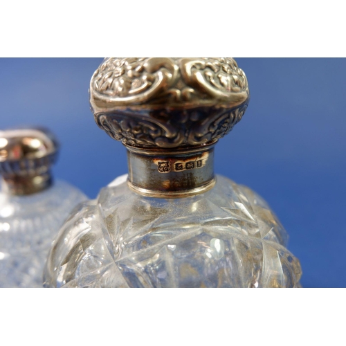 318 - A large Victorian cut glass scent bottle with silver lid, Birmingham 1908 and another with hinged li... 