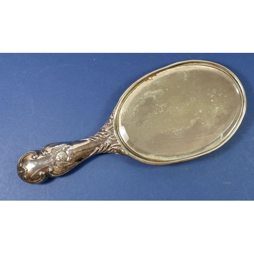 332 - A silver hand mirror embossed angels, Chester 1900