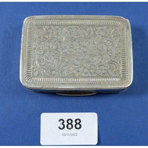 388 - A silver snuff box with all over engraved floral and foliage decoration, Chester 1889, 69g 7cm wide,... 