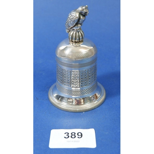 389 - An unmarked silver bell with owl handle, 147g