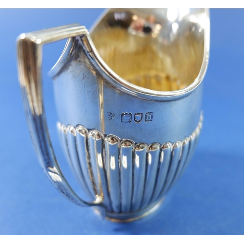 393 - A silver half gadrooned milk jug, London 1903, 138g