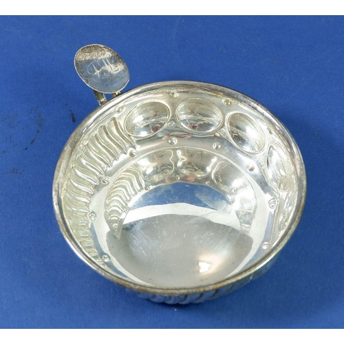 402 - A silver wine taster by R & W Sorley with circular and gadrooned decoration, 94g, London 1907