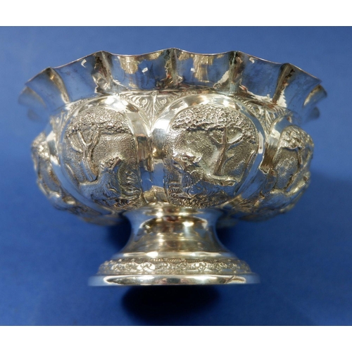 409 - An Indian silver bowl with embossed decoration of wild animals, 11cm diameter, 85g