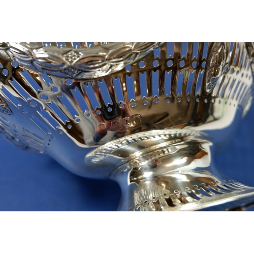 412 - A large silver pierced basket with embossed swags, London 1909 by SS, 518g