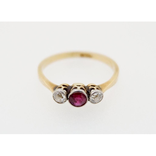 426 - An 18 carat gold ring set red stone flanked by two diamonds, size L-M, total weight 2g