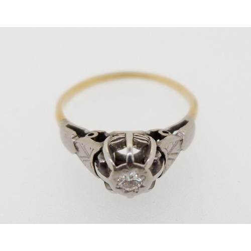 428 - A gold ring illusion set diamond, size L, marks rubbed