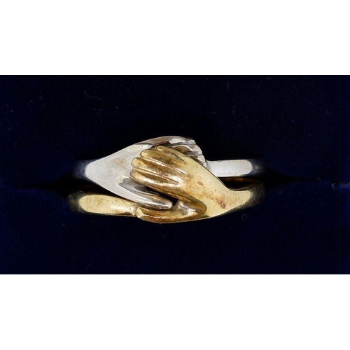 431 - A 14 carat yellow and white gold two part friendship ring with two interlocking hands, 5g