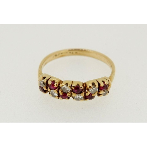 441 - A 9 carat gold ring set chequered row of six diamonds and six rubies, 1.9g, size K