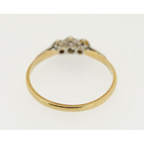 450 - An 18 ct gold three stone diamond ring, size S, 1.8g