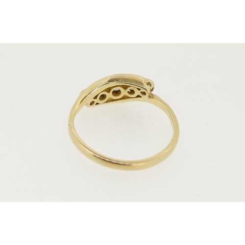 451 - An 18 carat gold ring crossover set five diamonds, 2.4g, size L