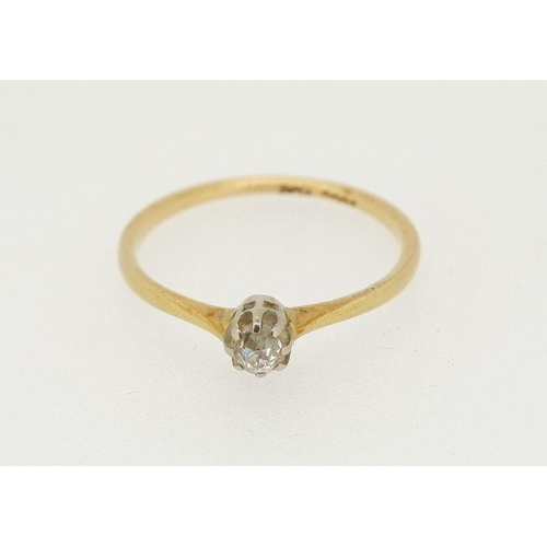 452 - An 18ct gold and platinum set solitaire diamond ring, size P, 2g