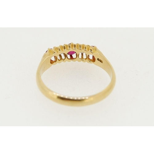 454 - An 18 carat gold ring set three rubies and two diamonds, size O to P