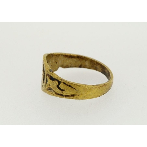 462 - An antique brass ring with 'A' monogram