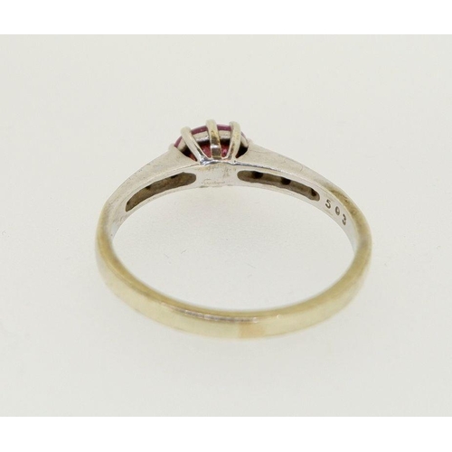 464 - A 9 carat white gold ring set oval cut pink sapphire on diamond chip shoulders, size O to P