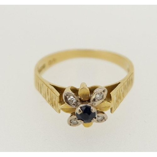 468 - An 18 carat gold diamond and sapphire cluster ring, size M to N