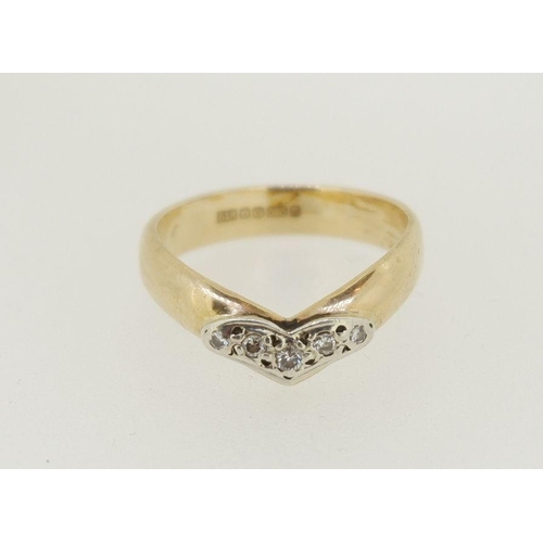 471 - A 9 carat gold wishbone form ring set five diamonds, size M