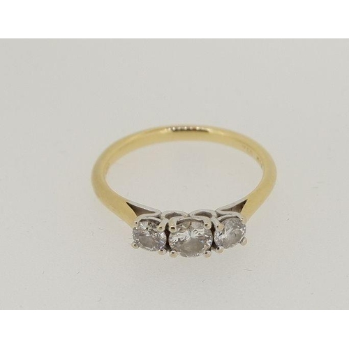 476 - An 18 carat gold three stone diamond ring, 2g, size I - J